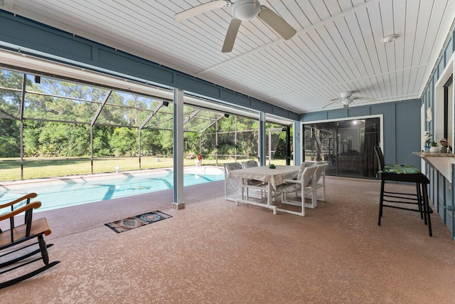 6045 Whipoorwill Ln, Fort Pierce, FL 34987 - outdoor pool featuring ceiling fan, a patio, and glass enclosure