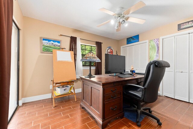 6045 Whipoorwill Ln, Fort Pierce, FL 34987 - office area with baseboards, wood finished floors, and a ceiling fan