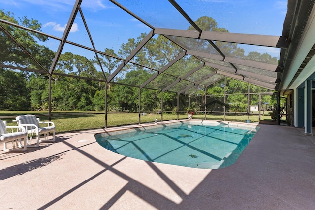 6045 Whipoorwill Ln, Fort Pierce, FL 34987 - outdoor pool with a patio, glass enclosure, and a lawn