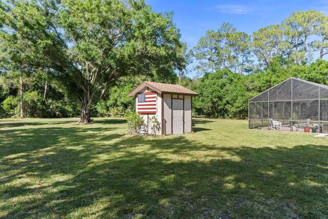 6045 Whipoorwill Ln, Fort Pierce, FL 34987 - view of grassy yard with a lanai