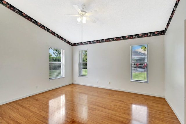 2445 Stonegate Dr, Wellington, FL 33414 - empty room with baseboards, a ceiling fan, light wood-style floors, and lofted ceiling