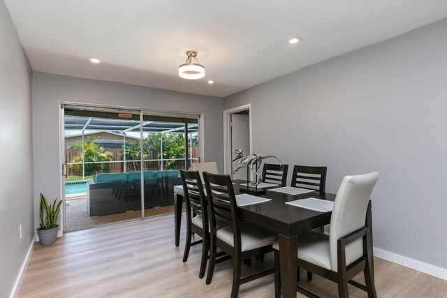 8421 NW 24th St, Sunrise, FL 33322 - dining space with a sunroom, recessed lighting, baseboards, and light wood-style floors