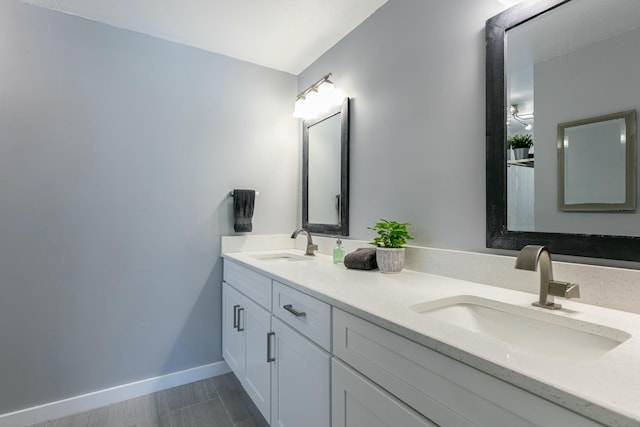 8421 NW 24th St, Sunrise, FL 33322 - full bath featuring double vanity, a sink, and baseboards