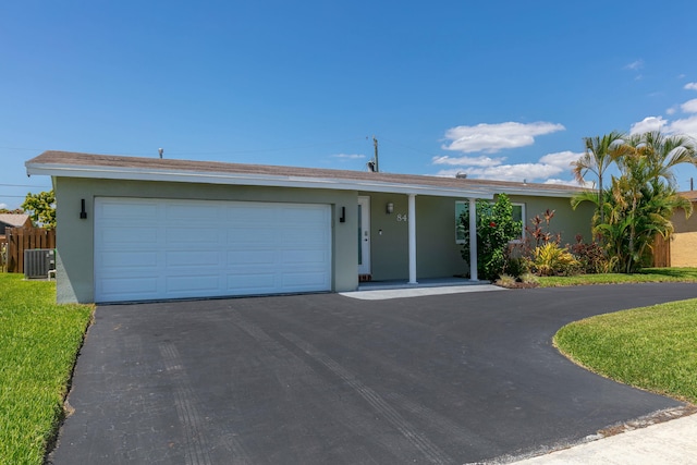 8421 NW 24th St, Sunrise, FL 33322 - single story home featuring an attached garage, stucco siding, driveway, and cooling unit