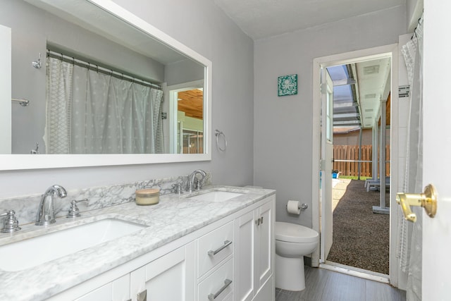 8421 NW 24th St, Sunrise, FL 33322 - full bath featuring double vanity, a sink, and toilet