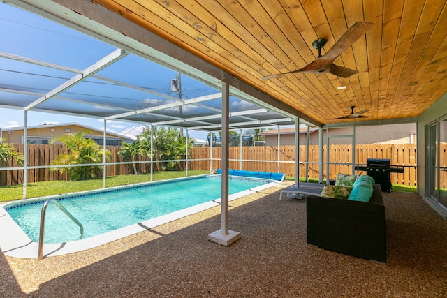 8421 NW 24th St, Sunrise, FL 33322 - view of swimming pool with glass enclosure, a fenced in pool, and a fenced backyard