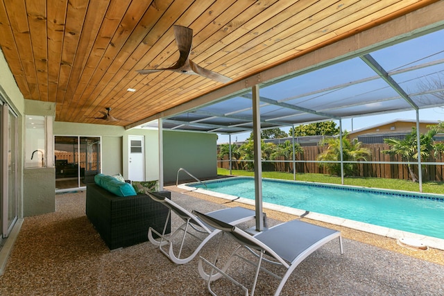 8421 NW 24th St, Sunrise, FL 33322 - view of swimming pool with a fenced in pool, a ceiling fan, fence private yard, and a patio area