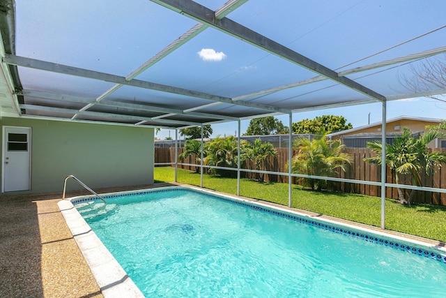 8421 NW 24th St, Sunrise, FL 33322 - view of pool featuring a fenced in pool, a fenced backyard, a lawn, and a lanai