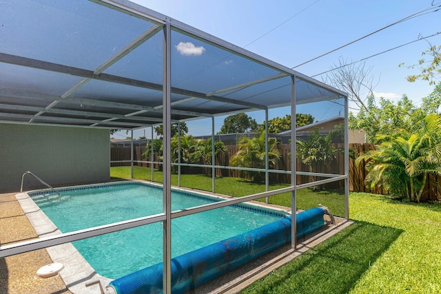 8421 NW 24th St, Sunrise, FL 33322 - view of swimming pool featuring a yard, a fenced in pool, a fenced backyard, and glass enclosure