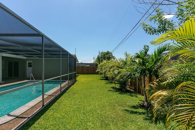 8421 NW 24th St, Sunrise, FL 33322 - view of yard featuring a fenced backyard, a fenced in pool, and glass enclosure