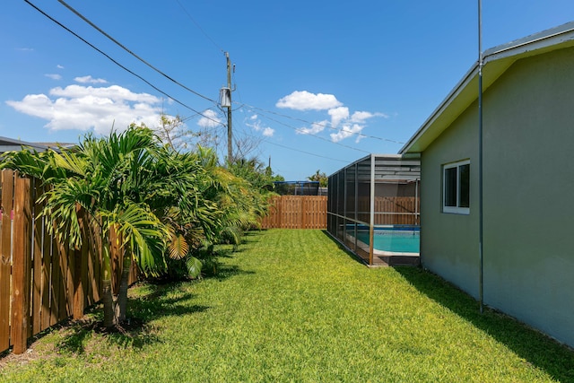 8421 NW 24th St, Sunrise, FL 33322 - view of yard featuring a fenced in pool and a fenced backyard