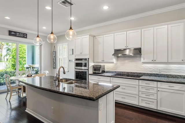 1345 Bourne Dr, Jupiter, FL 33458 - kitchen featuring visible vents, a sink, under cabinet range hood, double oven, and black electric stovetop