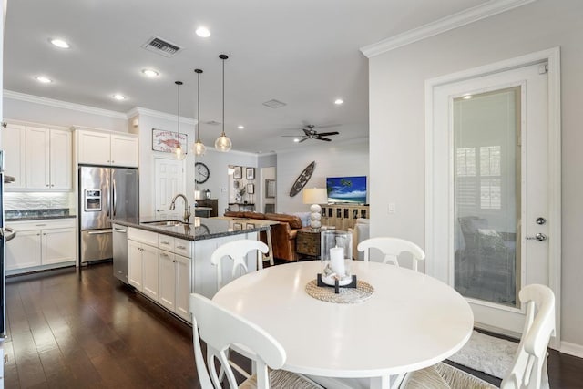 1345 Bourne Dr, Jupiter, FL 33458 - dining area with ornamental molding, recessed lighting, dark wood-style floors, visible vents, and ceiling fan