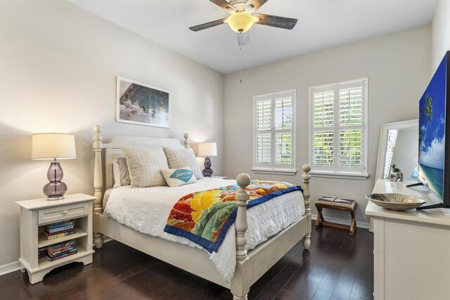 1345 Bourne Dr, Jupiter, FL 33458 - bedroom featuring dark wood-style flooring, baseboards, and ceiling fan