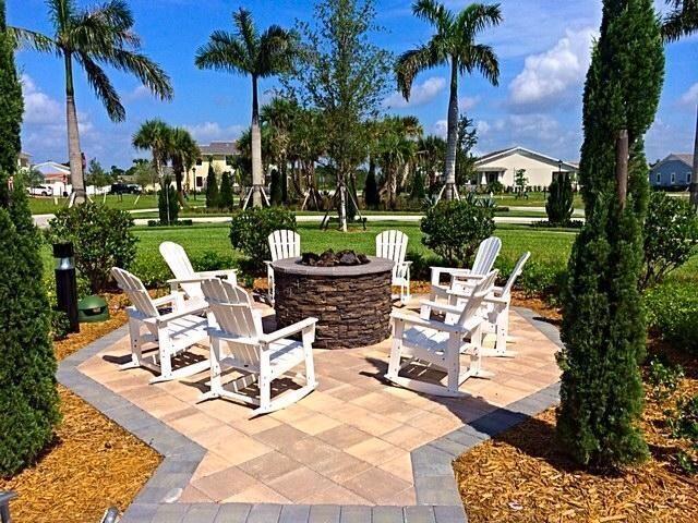 1345 Bourne Dr, Jupiter, FL 33458 - view of patio featuring an outdoor fire pit