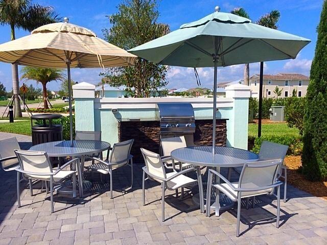 1345 Bourne Dr, Jupiter, FL 33458 - view of patio / terrace featuring outdoor dining space and area for grilling