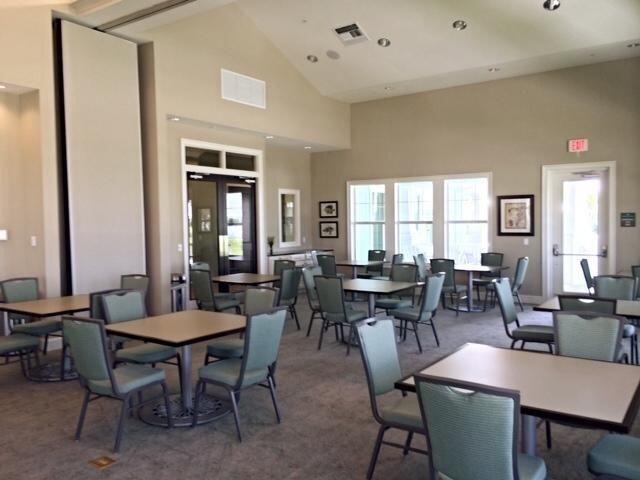 1345 Bourne Dr, Jupiter, FL 33458 - carpeted dining space with high vaulted ceiling, visible vents, and recessed lighting