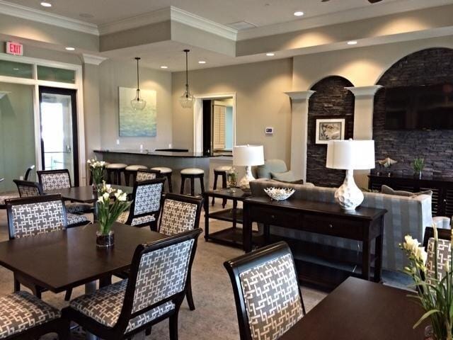 1345 Bourne Dr, Jupiter, FL 33458 - dining space featuring crown molding, recessed lighting, and decorative columns