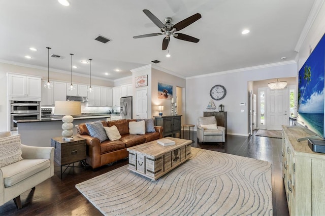 1345 Bourne Dr, Jupiter, FL 33458 - living area with ornamental molding, visible vents, a ceiling fan, and dark wood finished floors