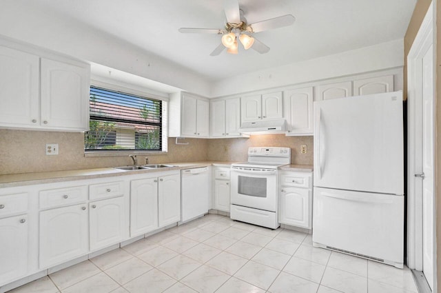 4655 Mahoe Tree Pl Unit A, Boynton Beach, FL 33436 - kitchen with white appliances, under cabinet range hood, a sink, light countertops, and white cabinetry