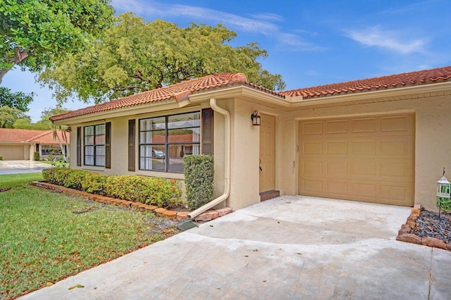4655 Mahoe Tree Pl Unit A, Boynton Beach, FL 33436 - view of front of house with concrete driveway, a garage, stucco siding, and a tiled roof