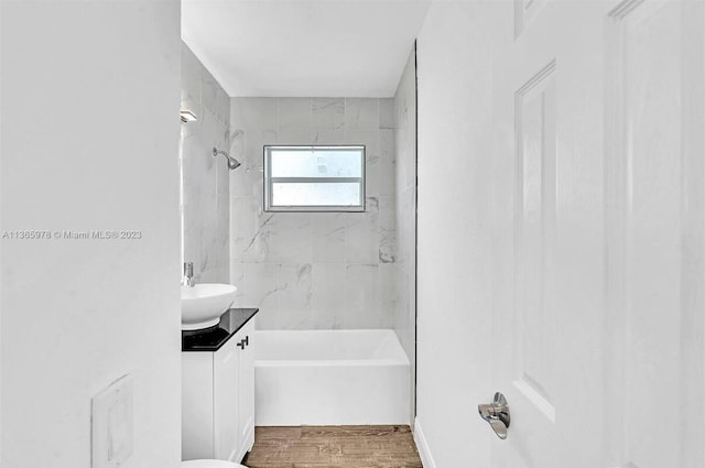 bathroom with vanity, shower / bathing tub combination, and wood finished floors