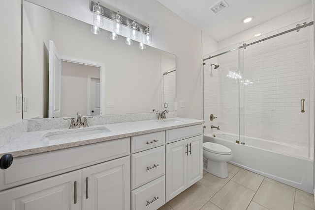 4770 SW Ardsley Dr, Stuart, FL 34997 - bathroom with double vanity, toilet, enclosed tub / shower combo, and tile patterned floors