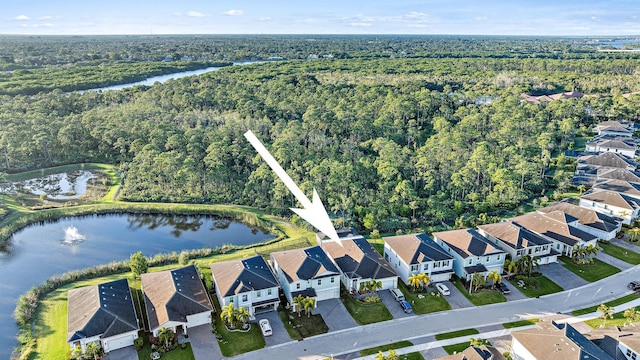 4770 SW Ardsley Dr, Stuart, FL 34997 - aerial overview of property's location with a forest, a nearby body of water, and nearby suburban area