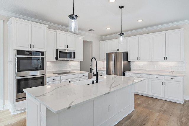 4770 SW Ardsley Dr, Stuart, FL 34997 - kitchen featuring stainless steel appliances, a sink, light wood-type flooring, ornamental molding, and white cabinets