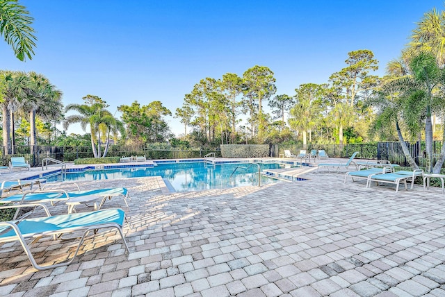4770 SW Ardsley Dr, Stuart, FL 34997 - community pool with a patio area