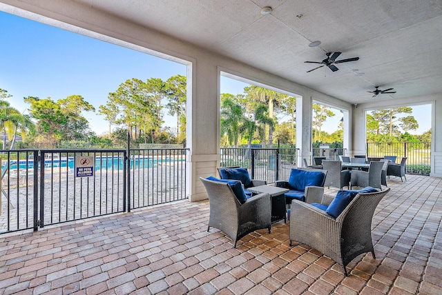 4770 SW Ardsley Dr, Stuart, FL 34997 - view of patio featuring a ceiling fan, outdoor dining space, and outdoor lounge area