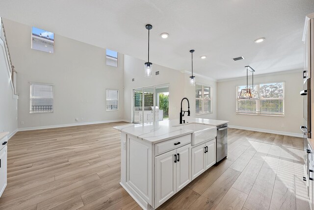4770 SW Ardsley Dr, Stuart, FL 34997 - kitchen with a sink, light wood finished floors, dishwasher, decorative light fixtures, and recessed lighting