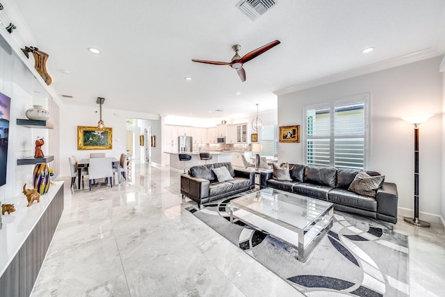 living area with visible vents, baseboards, a ceiling fan, crown molding, and marble finish floor