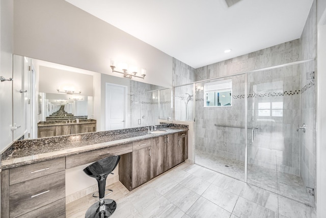 full bathroom featuring a shower stall and vanity