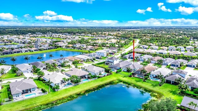 birds eye view of property featuring a residential view and a water view