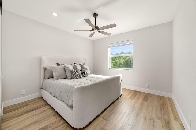 bedroom with recessed lighting, ceiling fan, baseboards, and light wood-style flooring