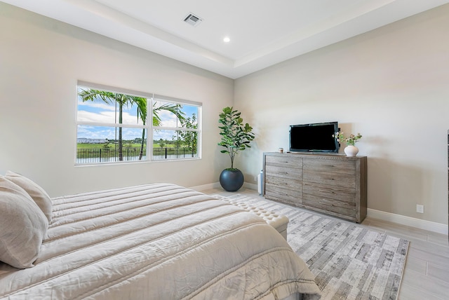 12618 Nautilus Cir, Palm Beach Gardens, FL 33412 - bedroom featuring visible vents, baseboards, recessed lighting, and light wood-style floors