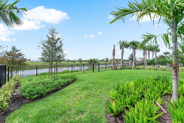 12618 Nautilus Cir, Palm Beach Gardens, FL 33412 - view of yard featuring a fenced backyard and a water view