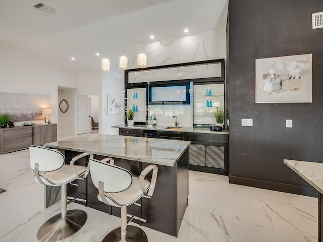 8540 Lake Cypress Rd, Lake Worth, FL 33467 - bar with visible vents, marble finish floor, a sink, and hanging light fixtures