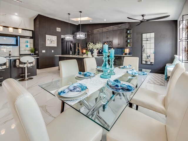8540 Lake Cypress Rd, Lake Worth, FL 33467 - dining space featuring ceiling fan with notable chandelier, marble finish floor, and recessed lighting