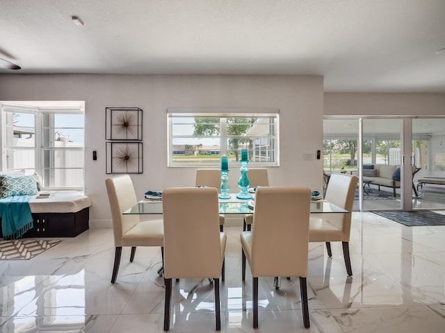 8540 Lake Cypress Rd, Lake Worth, FL 33467 - dining space featuring marble finish floor and a textured ceiling