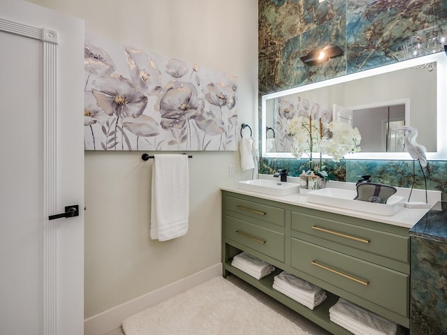 8540 Lake Cypress Rd, Lake Worth, FL 33467 - bathroom featuring double vanity, a sink, and baseboards