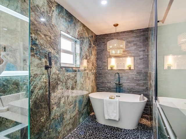 8540 Lake Cypress Rd, Lake Worth, FL 33467 - bathroom featuring tile walls, marble finish floor, walk in shower, and a soaking tub