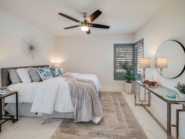 8540 Lake Cypress Rd, Lake Worth, FL 33467 - bedroom with baseboards, marble finish floor, and a ceiling fan