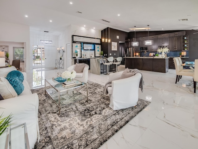 8540 Lake Cypress Rd, Lake Worth, FL 33467 - living room with marble finish floor, a notable chandelier, visible vents, and recessed lighting