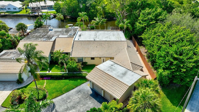 birds eye view of property with a water view and a residential view