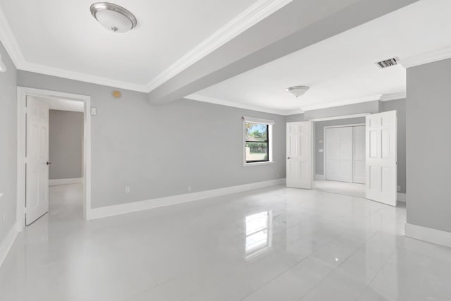 interior space featuring crown molding, baseboards, and visible vents
