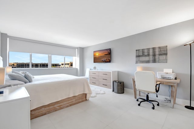 bedroom featuring baseboards