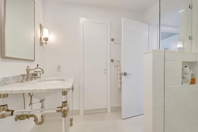 full bathroom featuring tiled shower