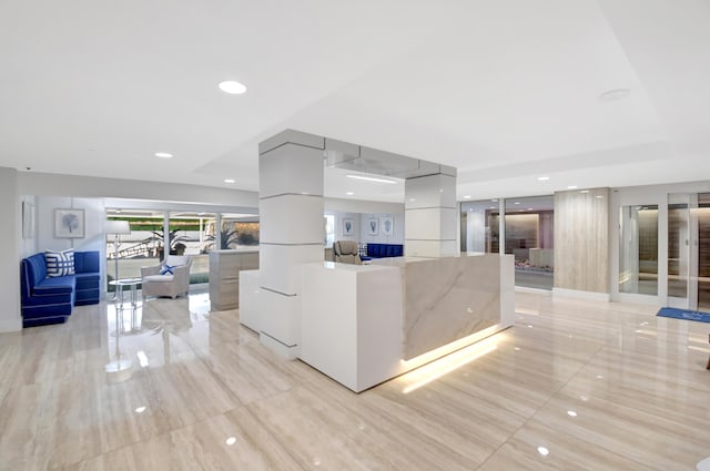 interior space with light tile patterned floors and recessed lighting